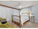 Comfortable bedroom featuring light blue walls, a ceiling fan, and two closets with white paneled doors at 6147 Sunnyvale Dr # Ge, Orlando, FL 32822