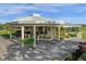 Welcoming clubhouse with a grand entrance and well-manicured landscaping at 6147 Sunnyvale Dr # Ge, Orlando, FL 32822