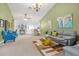 Open-concept living room and dining area with neutral tones and ample natural light at 6147 Sunnyvale Dr # Ge, Orlando, FL 32822