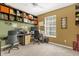 Functional home office with built-in shelving and a large window for natural light at 6147 Sunnyvale Dr # Ge, Orlando, FL 32822