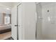 Bathroom featuring a glass-enclosed shower and convenient access to an adjacent bedroom at 634 Chadbury Way, Kissimmee, FL 34744