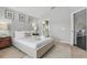 Cozy bedroom with a neutral color scheme, plush bedding, and an ensuite bathroom at 634 Chadbury Way, Kissimmee, FL 34744