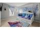 Bright bedroom with a large Frozen-themed mural, comfortable bed and a window at 634 Chadbury Way, Kissimmee, FL 34744