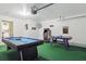 A game room offers entertainment with a pool table, air hockey, and arcade games at 634 Chadbury Way, Kissimmee, FL 34744