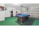 Fun game room equipped with a pool table, air hockey, and arcade games for entertainment at 634 Chadbury Way, Kissimmee, FL 34744