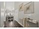 Bright hallway featuring elegant decor, leading to an open-concept dining and living area with stylish accents at 634 Chadbury Way, Kissimmee, FL 34744