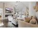 Bright living room with fireplace, large comfortable seating, and an open floor plan to the kitchen at 634 Chadbury Way, Kissimmee, FL 34744