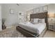 Bedroom showcases a decorative headboard, soft carpet, and cozy textiles, creating a restful retreat at 634 Chadbury Way, Kissimmee, FL 34744