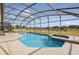 View of the enclosed pool and integrated spa in the back yard at 634 Chadbury Way, Kissimmee, FL 34744