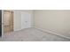 Bedroom features neutral walls, a carpeted floor, and a closet at 690 Blue Citrus Ln, Minneola, FL 34715