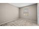 Cozy bedroom featuring neutral carpet and natural light from the window at 690 Blue Citrus Ln, Minneola, FL 34715