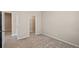 Bedroom with carpet, neutral paint, and view of the walk-in closet at 690 Blue Citrus Ln, Minneola, FL 34715