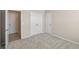 Carpeted bedroom with walk-in closet and ensuite bathroom at 690 Blue Citrus Ln, Minneola, FL 34715