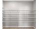 Pantry features white wire shelving and beige walls, great for organized storage at 690 Blue Citrus Ln, Minneola, FL 34715