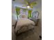 A beautifully furnished bedroom features bright green walls, statement mirror, and decorative bedding at 712 Leonardo Ct, Kissimmee, FL 34758