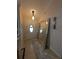 A stylish foyer features neutral walls, and a large mirror that reflects the front door at 712 Leonardo Ct, Kissimmee, FL 34758