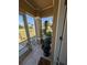 Screened porch with views to the street and tiled flooring, featuring decorative potted plants at 712 Leonardo Ct, Kissimmee, FL 34758