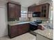 Well-equipped kitchen featuring modern appliances and wood cabinetry for the home chef at 712 Leonardo Ct, Kissimmee, FL 34758