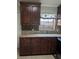 Granite countertops and wood cabinets in the kitchen offer style and functionality at 712 Leonardo Ct, Kissimmee, FL 34758