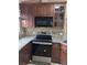 Upgraded kitchen features modern appliances, granite countertops, and ample cabinet space for storage at 712 Leonardo Ct, Kissimmee, FL 34758