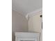 Close-up on the crown molding between the wall and ceiling with a cabinet visible at 712 Leonardo Ct, Kissimmee, FL 34758