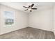 Bedroom featuring a ceiling fan, window with blinds, carpet floors, and neutral paint throughout at 8991 Fluffy Lie Ct, Davenport, FL 33896