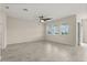 Spacious living room featuring tile floors, a modern ceiling fan and a natural light at 8991 Fluffy Lie Ct, Davenport, FL 33896