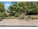 Backyard featuring a concrete patio with furniture and lush landscaping at 907 Ridge Spring Ct, Apopka, FL 32712