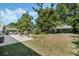 Sprawling backyard with an expansive patio, seating, and lush landscaping at 907 Ridge Spring Ct, Apopka, FL 32712