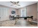 This bedroom offers natural light, a ceiling fan, and closet with sliding doors at 907 Ridge Spring Ct, Apopka, FL 32712