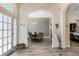 Inviting dining area with elegant lighting, stylish wallpaper, and wood-look tile flooring at 907 Ridge Spring Ct, Apopka, FL 32712