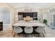 Bright kitchen with a large island, stainless steel appliances, and access to the laundry room at 907 Ridge Spring Ct, Apopka, FL 32712