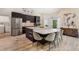 Modern kitchen featuring a large island with seating, stainless steel appliances, and stylish cabinets at 907 Ridge Spring Ct, Apopka, FL 32712