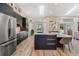 Bright eat-in kitchen with center island with seating, stainless appliances, and lots of natural light at 907 Ridge Spring Ct, Apopka, FL 32712