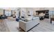 Open concept living area with stylish tile floors and a comfortable sofa at 907 Ridge Spring Ct, Apopka, FL 32712