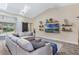 Cozy living room with vaulted ceiling, stylish decor, and a sliding glass door to the patio at 907 Ridge Spring Ct, Apopka, FL 32712