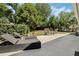 Landscaped backyard with patio featuring seating and lounge chairs at 907 Ridge Spring Ct, Apopka, FL 32712