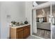 Indoor wet bar next to sliding glass doors to the living room at 907 Ridge Spring Ct, Apopka, FL 32712