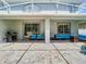 Spacious patio with stylish seating, a barbecue area, and partial shade for outdoor comfort at 9076 Lake Avon Dr, Orlando, FL 32829