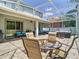 Spacious patio featuring dining and relaxation zones, plus an outdoor kitchen for ultimate outdoor enjoyment at 9076 Lake Avon Dr, Orlando, FL 32829