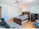 Well-lit bedroom with a bed, closet, desk area, and plenty of space for activities at 9076 Lake Avon Dr, Orlando, FL 32829