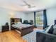 Inviting bedroom showcases a cozy bed, a plush rug, and natural light from the window at 9076 Lake Avon Dr, Orlando, FL 32829