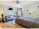 Green bedroom with a twin-sized bed, futon, and exercise equipment at 9076 Lake Avon Dr, Orlando, FL 32829