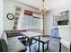 Bright eat-in kitchen area with a booth, table, large window, gray accents, and plenty of natural light at 9076 Lake Avon Dr, Orlando, FL 32829