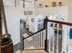 Bright, two-story foyer with dark wood floors and staircase, with views into other living spaces at 9076 Lake Avon Dr, Orlando, FL 32829