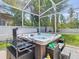 Luxurious outdoor hot tub with ample seating and well-maintained landscaping at 9076 Lake Avon Dr, Orlando, FL 32829