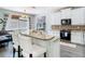 Stylish kitchen with stainless steel appliances, granite countertops and barstool seating at 9076 Lake Avon Dr, Orlando, FL 32829