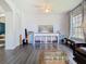 Bright living room with hardwood floors and a large window at 9076 Lake Avon Dr, Orlando, FL 32829
