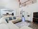 Spacious living room with two-story entrance and large sectional at 9076 Lake Avon Dr, Orlando, FL 32829