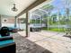 Screened patio with an outdoor kitchen and a luxurious hot tub. Perfect for entertaining at 9076 Lake Avon Dr, Orlando, FL 32829